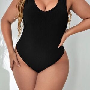 Sleek Black Bodysuit with High-Cut Design